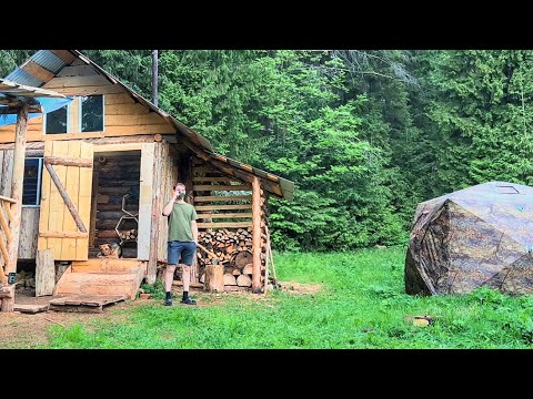 I live alone in the wilderness - I carry logs for a future bath! We visited our dugout