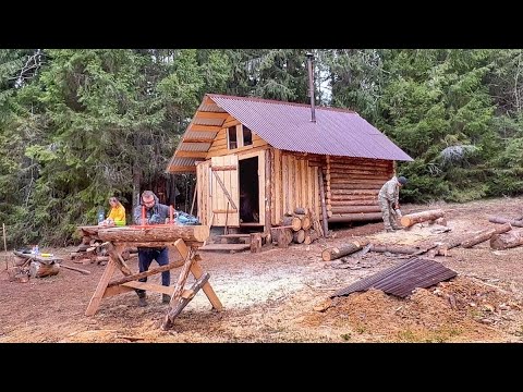 Designing a Secret Underground Food Storage in a Log Cabin. Cooking food outdoors in a cauldron