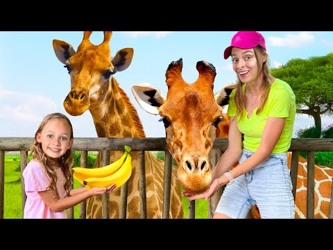 Maya feeds animals at the zoo - Children's song about a family trip