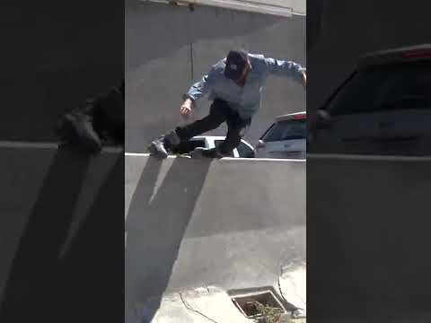 Chris Calkins grinding the side of a freeway in Los Angeles (Rollerblading)