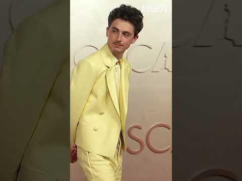 Timothée Chalamet walks the red carpet at the Oscars dressed in yellow