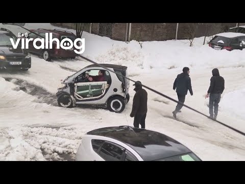 People Help Push A Mini Car Out Of The Snow || ViralHog