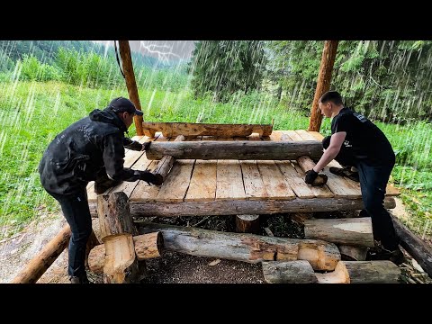 Building a Log Cabin in a Thunderstorm in Siberian Forest. Outdoor Cooking on the fire