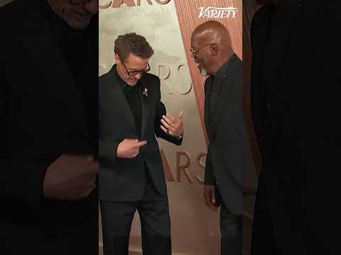 Samuel L. Jackson interrupts Robert Downey Jr.'s photos on the Oscars red carpet