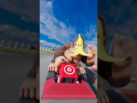 Sonic the Hedgehog vs Donkey Kong in a short race in a Mario Kart track