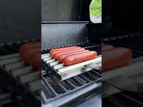 This vintage hot dog roller fits right on your grill