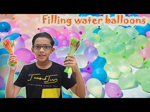 Filling water balloons for Holi.