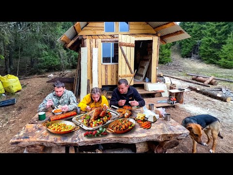 In Log Cabin in the Forest. Outdoor Cooking, Campfire Food, Earth Oven, Cauldron Food in  Wilderness