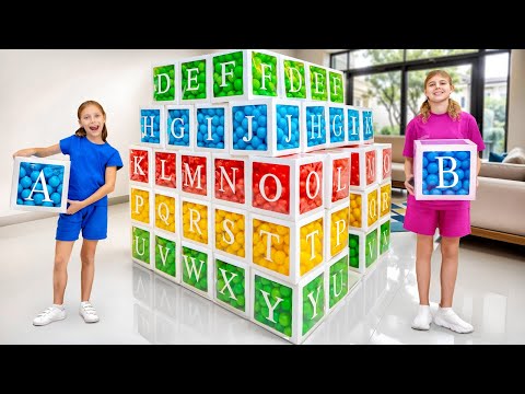 Girls play and build ABC playhouse with colored balls 🟥🟨🟩🟦