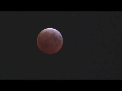 Total lunar eclipse gives moon red tint